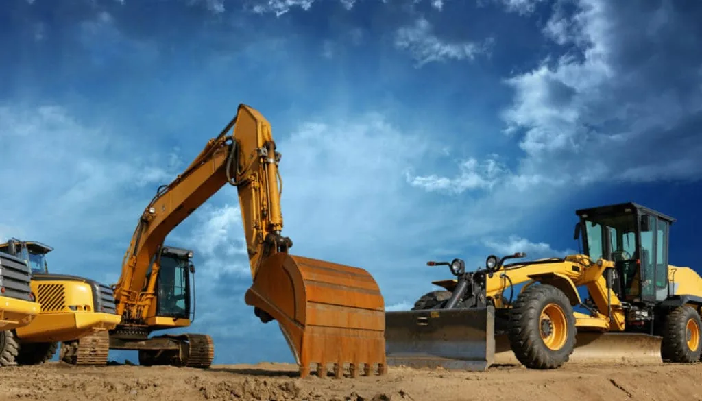 2000s era heavy construction equipment — bulldozer loaded onto a haul truck