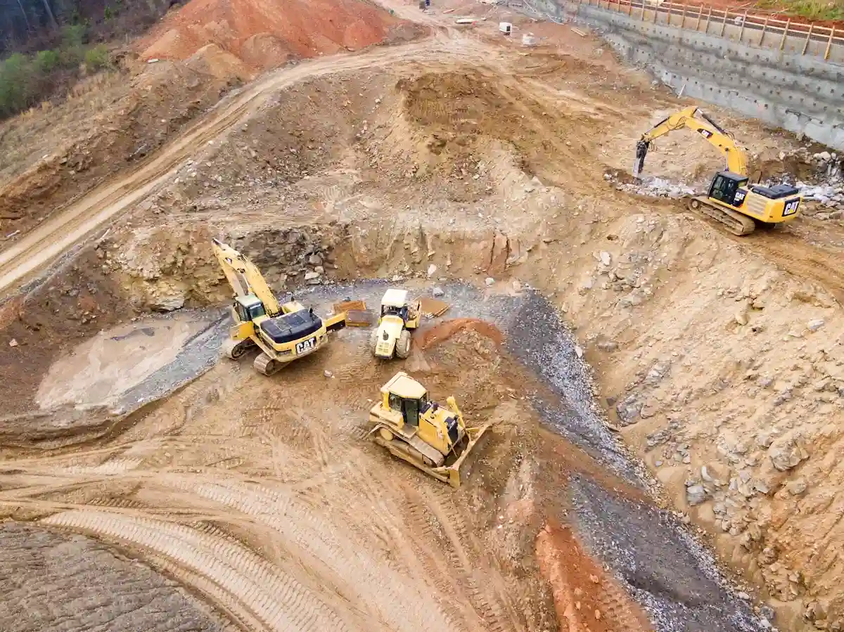 Top view of heavy equipment working at a construction site