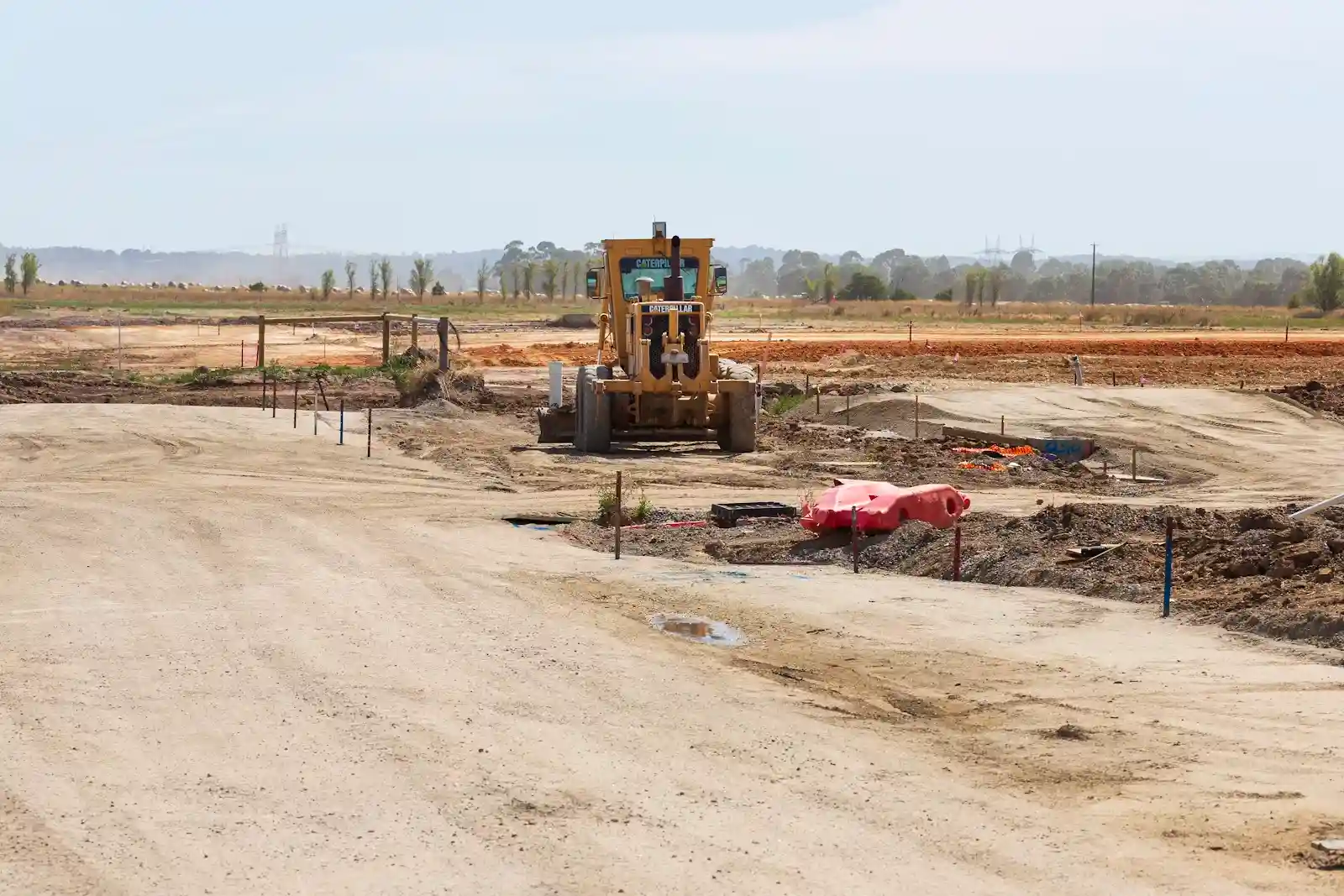 A bulldozer working in the middle of a construction site